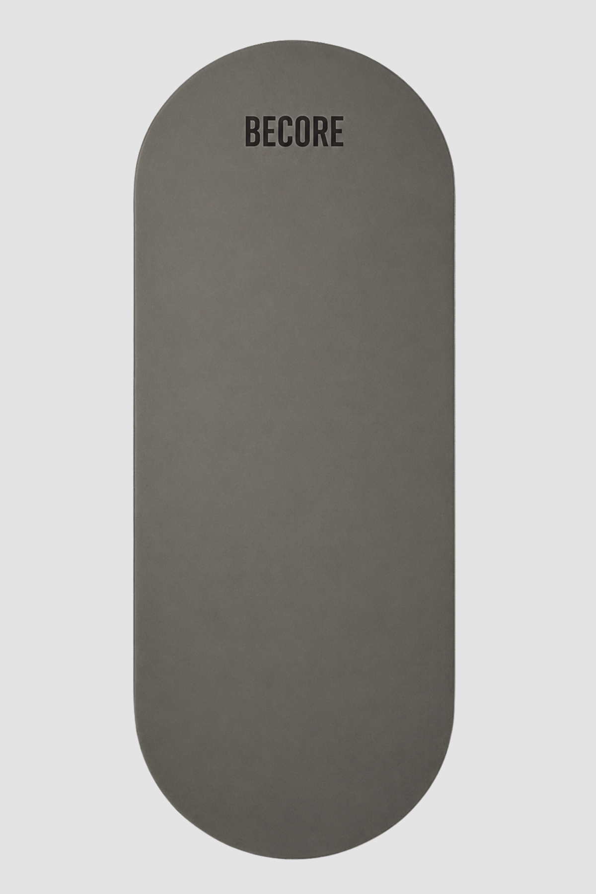Gray exercise yoga mat with BECORE branding on a light gray background